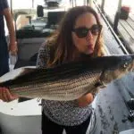 Woman kissing a fish