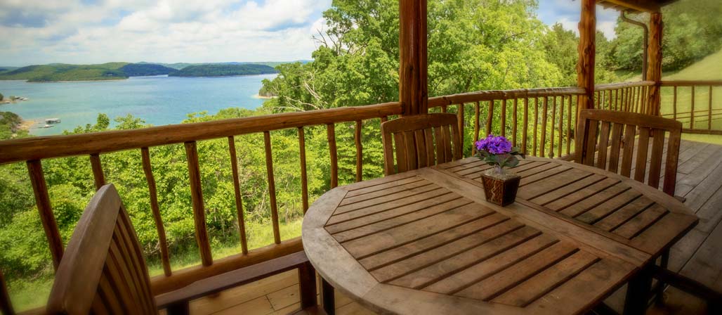 Cabin 4 outdoor deck seating with view of Beaver Lake
