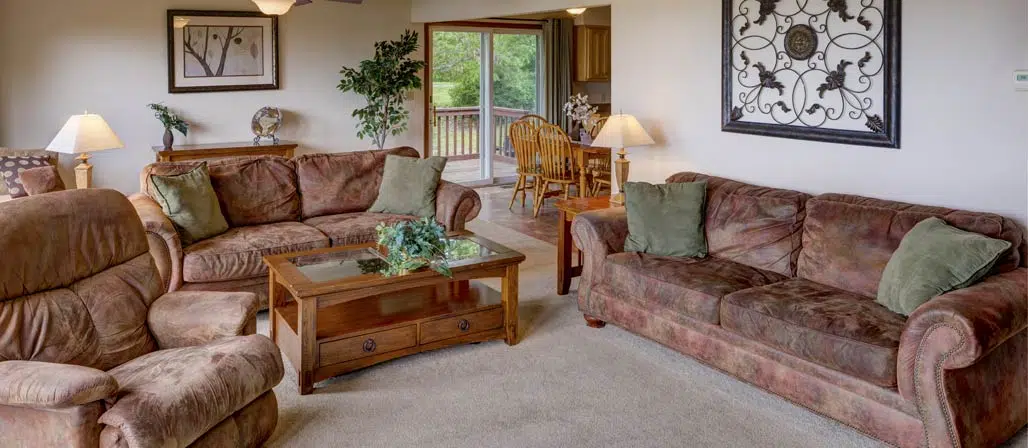 Lakehouse seating area with couches and recliner