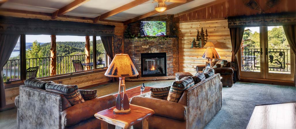Seating area with television and fireplace in the Tree Top Suite